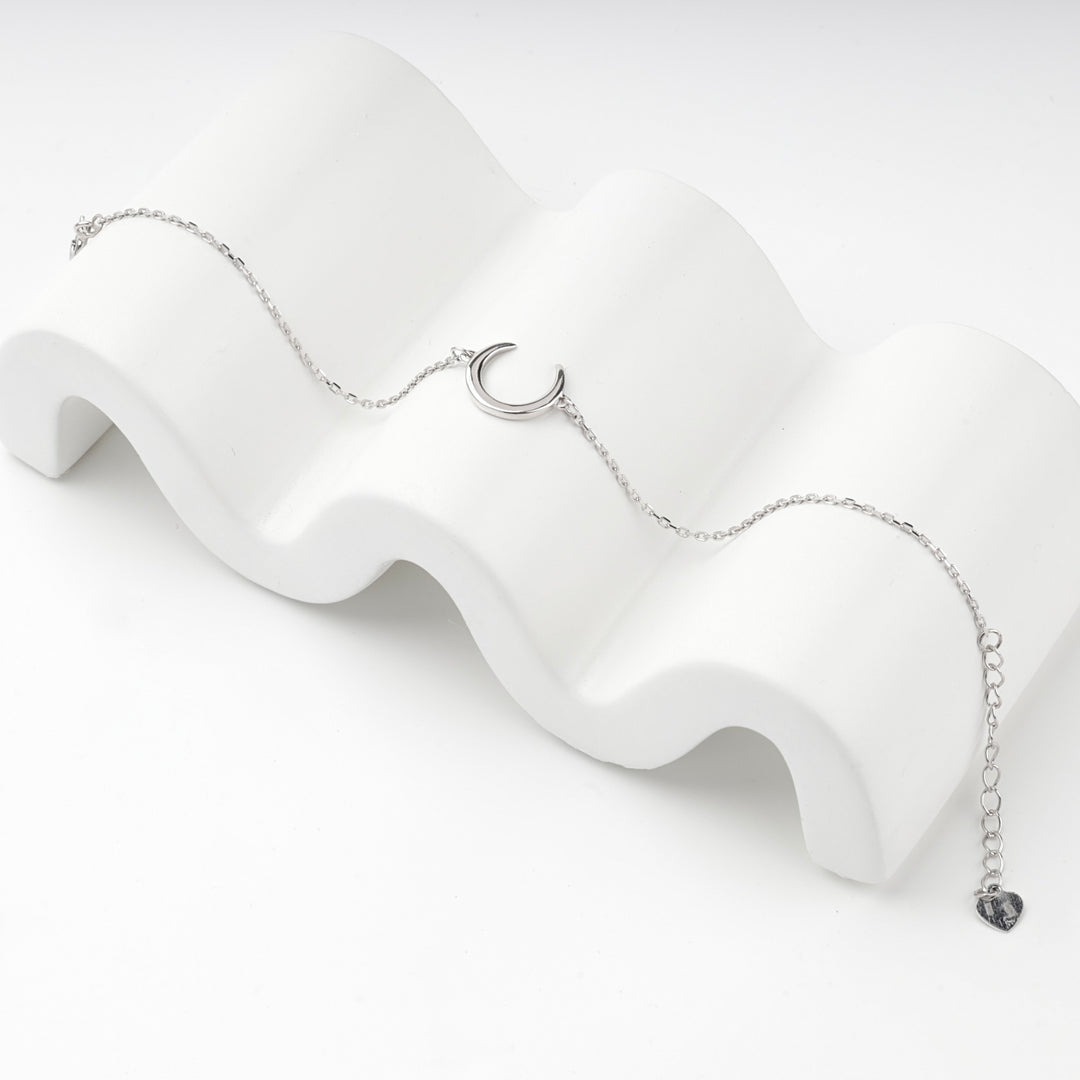 Silver 925 crescent bracelet with clasp, extender chain and heart tag visible
