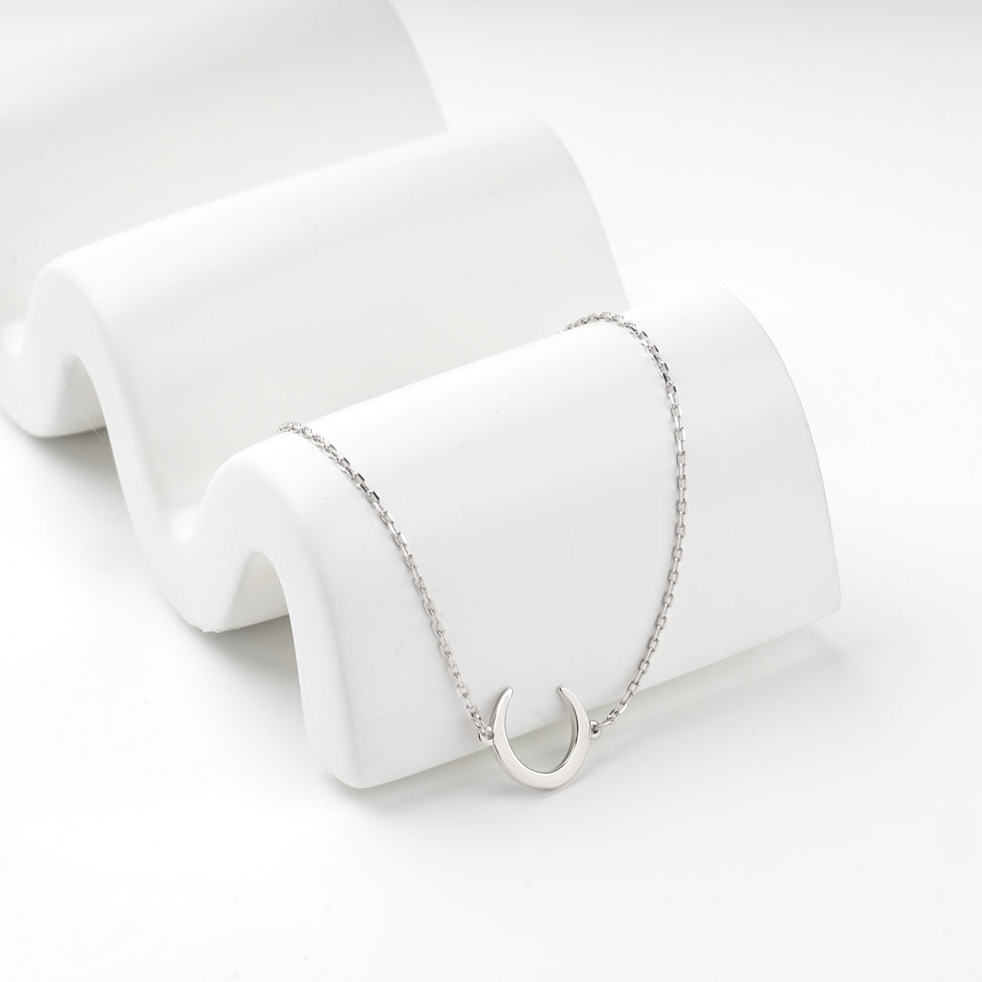 Silver 925 crescent moon bracelet on a plain white background