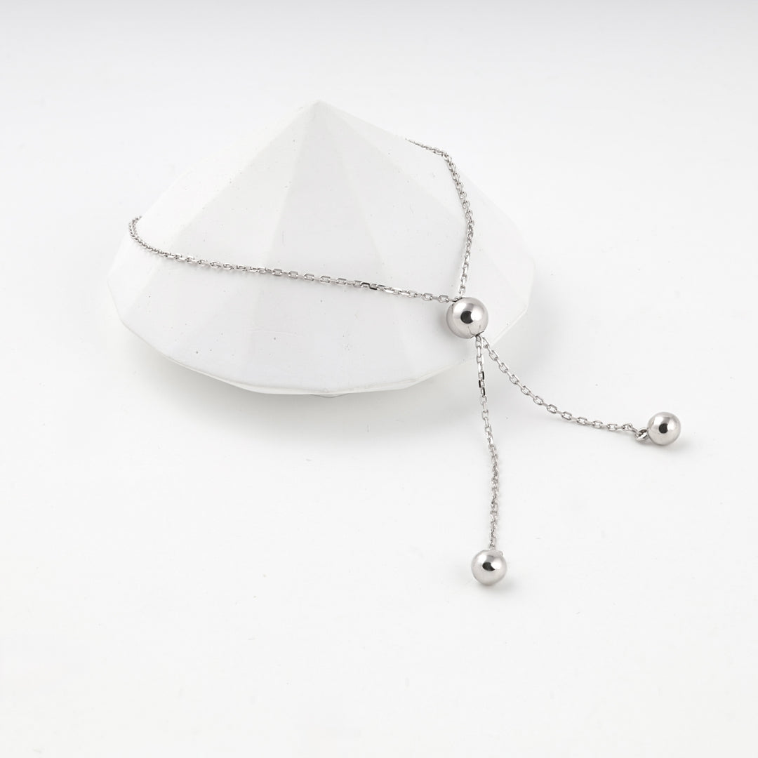 Silver 925 bolo bracelet resting on a white faceted prop