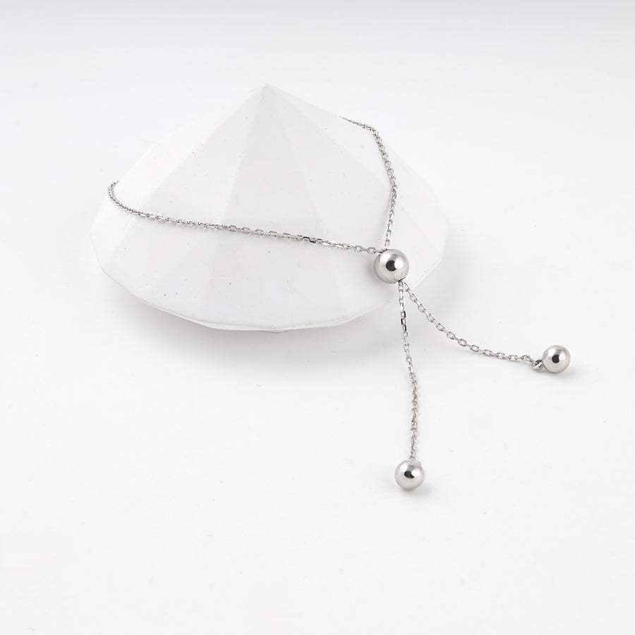 Silver 925 bolo bracelet resting on a white faceted prop