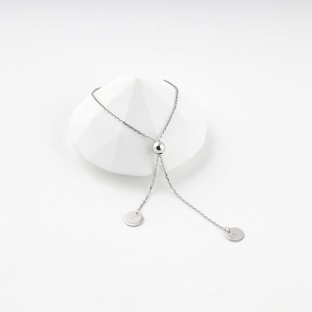 Silver 925 disc charm bracelet with its sliding bead pulled up the chain