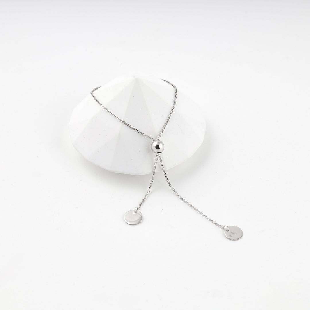 Silver 925 disc charm bracelet with its sliding bead pulled up the chain