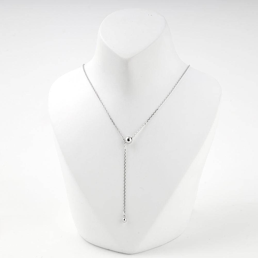 Silver 925 ball drop Y necklace on a white display bust