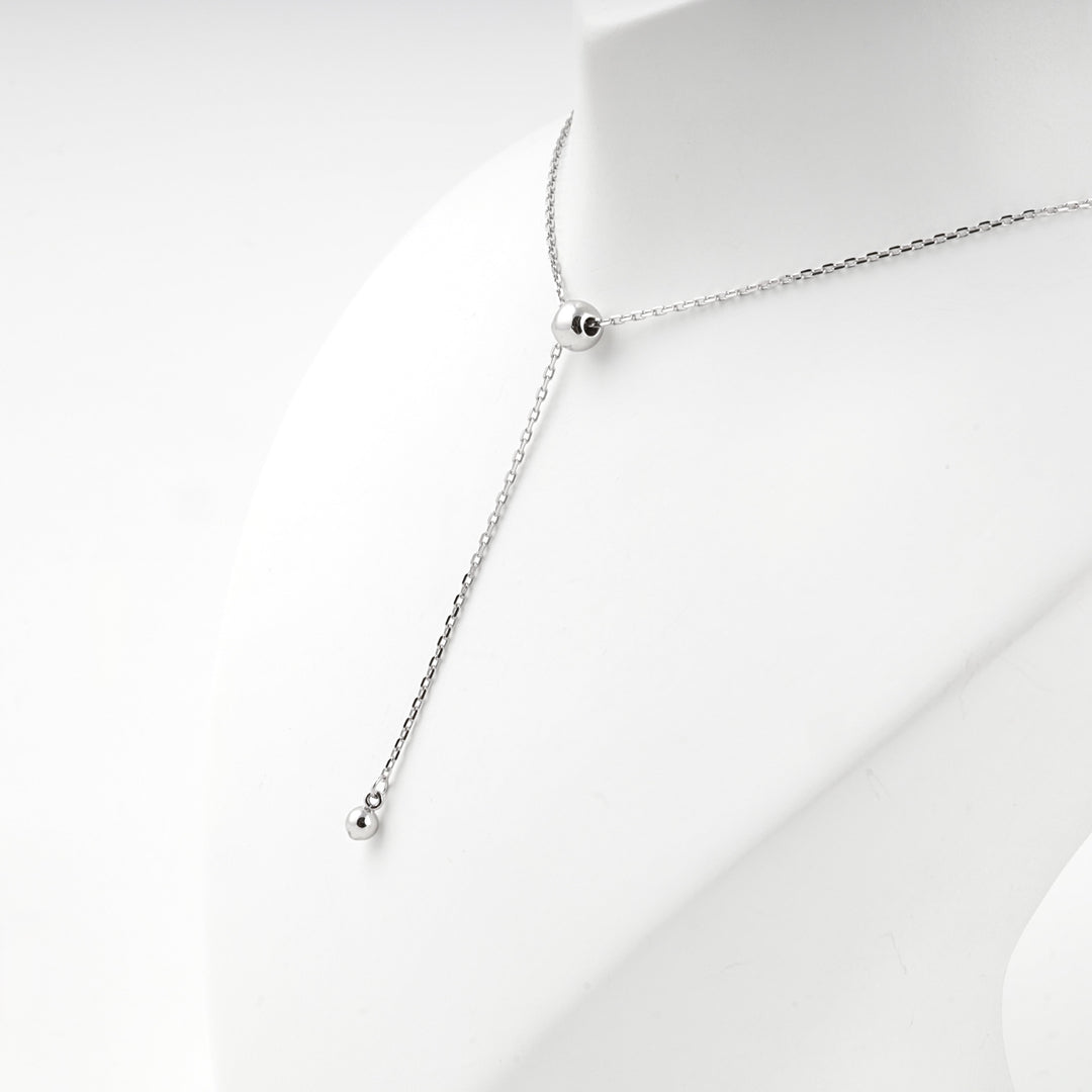 Close view of the bead where the chain turns down into the drop