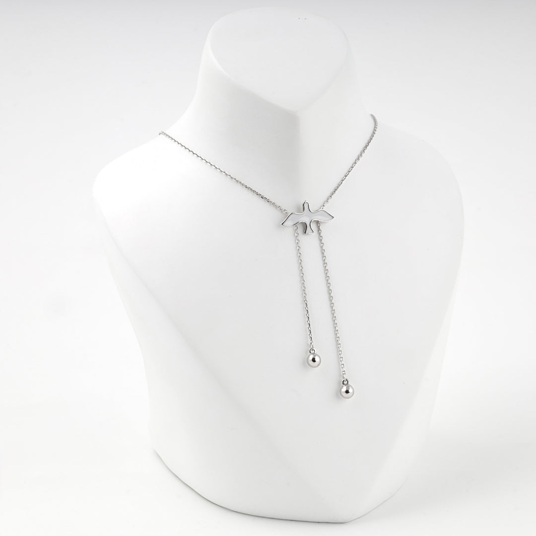 Angled view of the bird necklace on the display bust