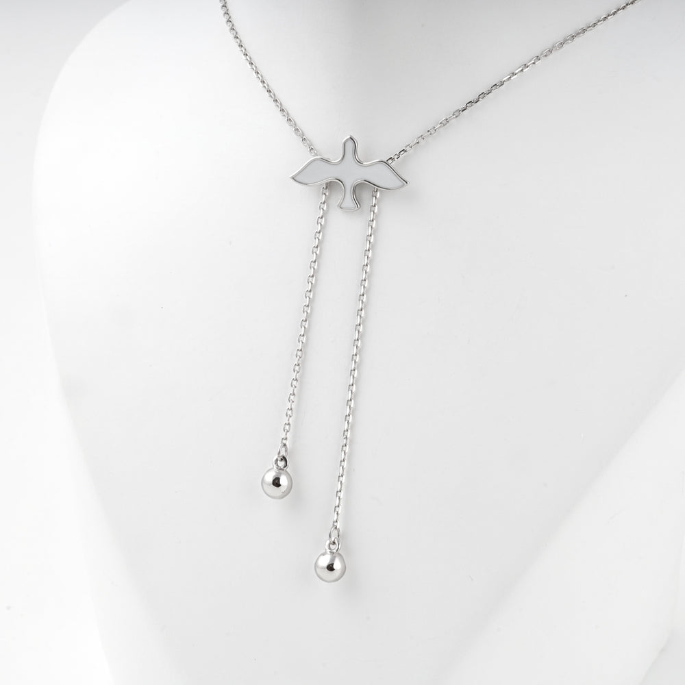 Close view of the silver bird and the two chain drops