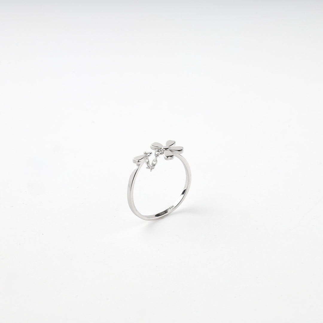 Silver 925 open ring standing upright with the flower at the top
