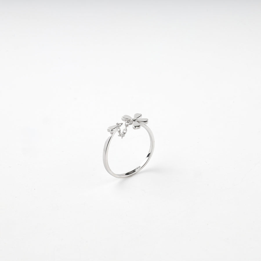 Silver 925 open ring standing upright with the flower at the top