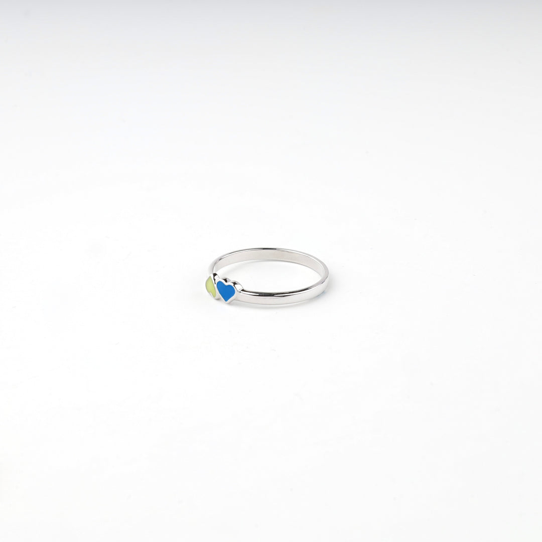 Silver 925 enamel heart ring resting on a white surface