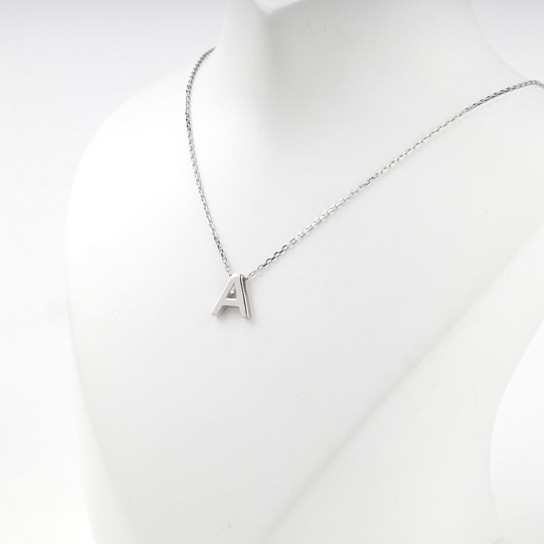 Close view of the silver letter A pendant on the fine anchor chain