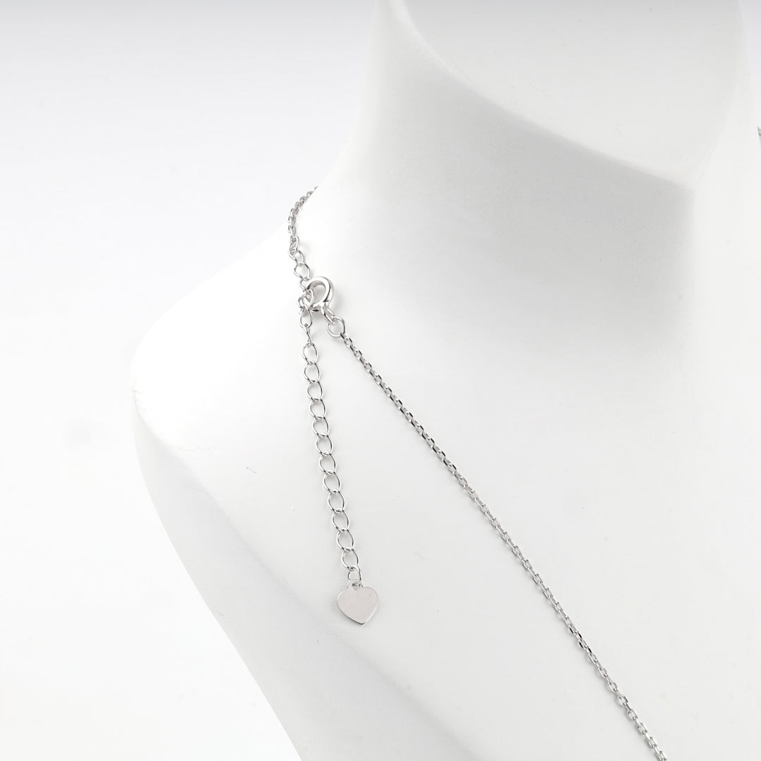 Back of the letter K necklace showing the clasp, extender chain and heart tag