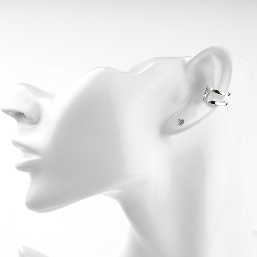 Silver 925 ear cuff worn on the edge of a mannequin ear