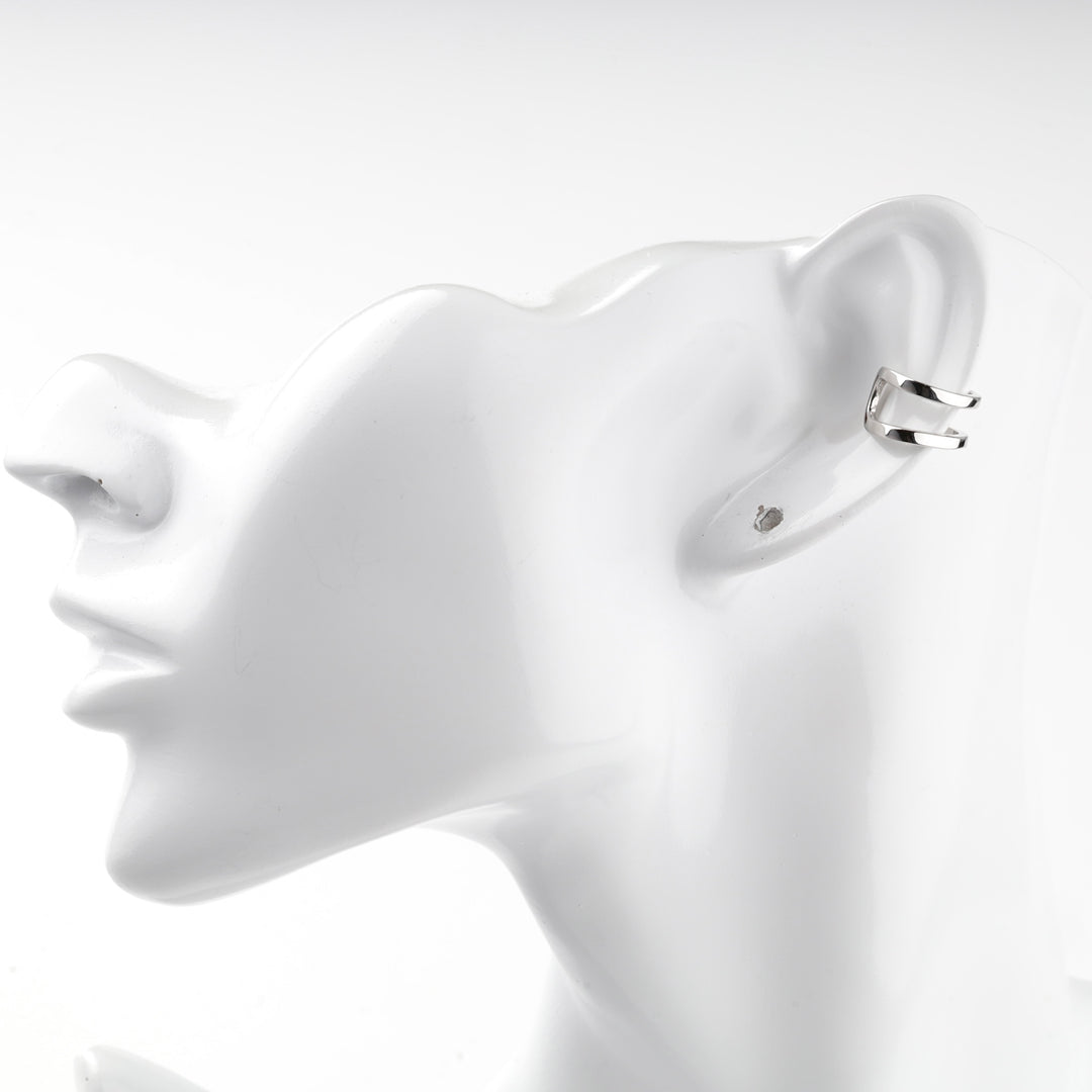 Silver 925 ear cuff worn on the edge of a mannequin ear