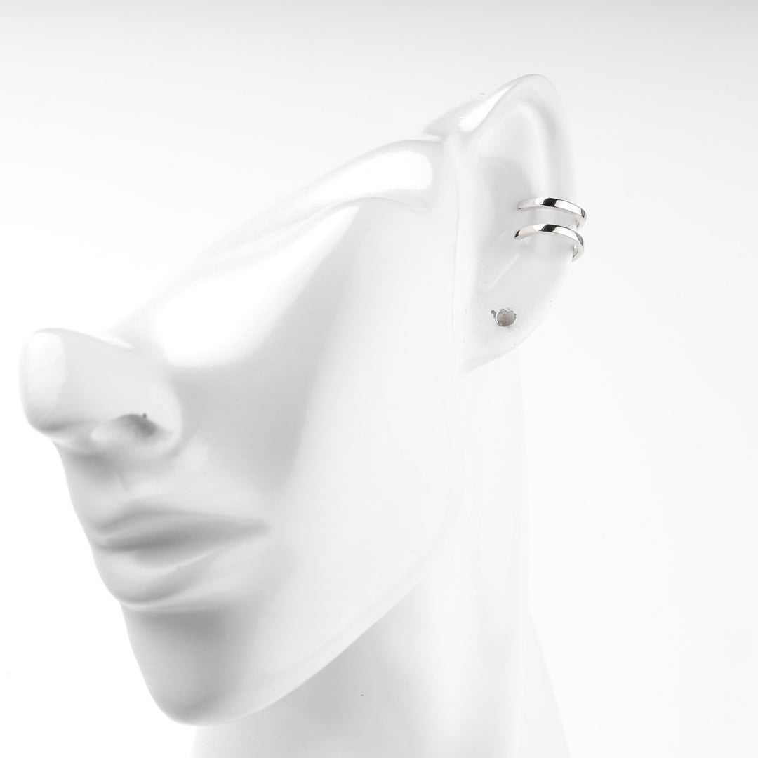 Profile view of the silver 925 double band ear cuff on a mannequin