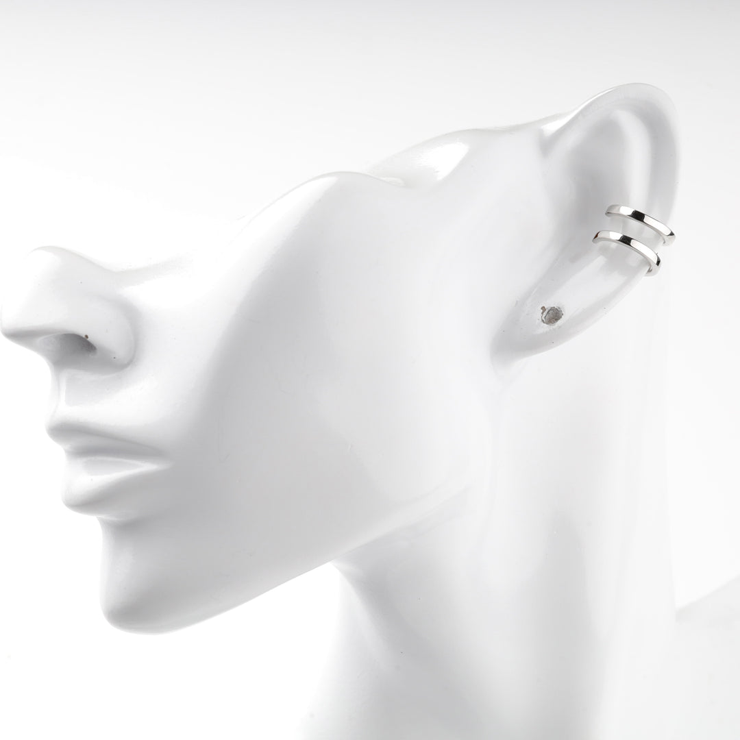 Silver 925 ear cuff seen from the back of a mannequin ear
