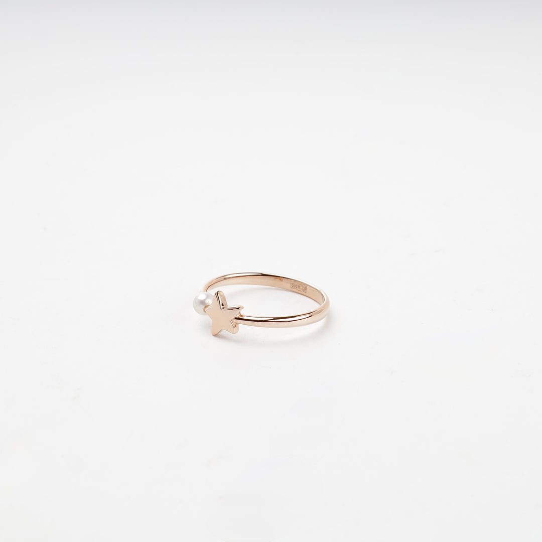 Open rose gold ring star pearl top view