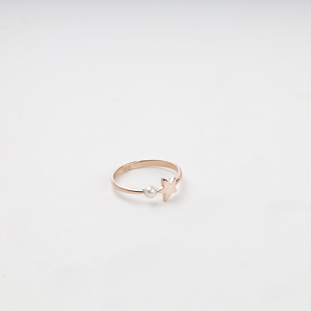 Open rose gold ring with star and pearl front view