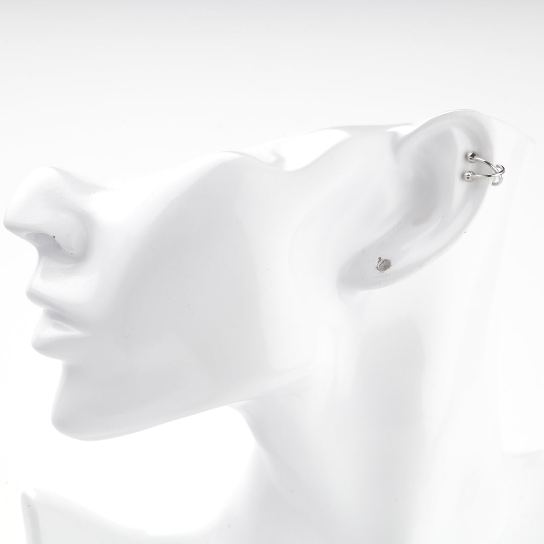 Silver 925 ear cuff on the upper edge of a mannequin ear