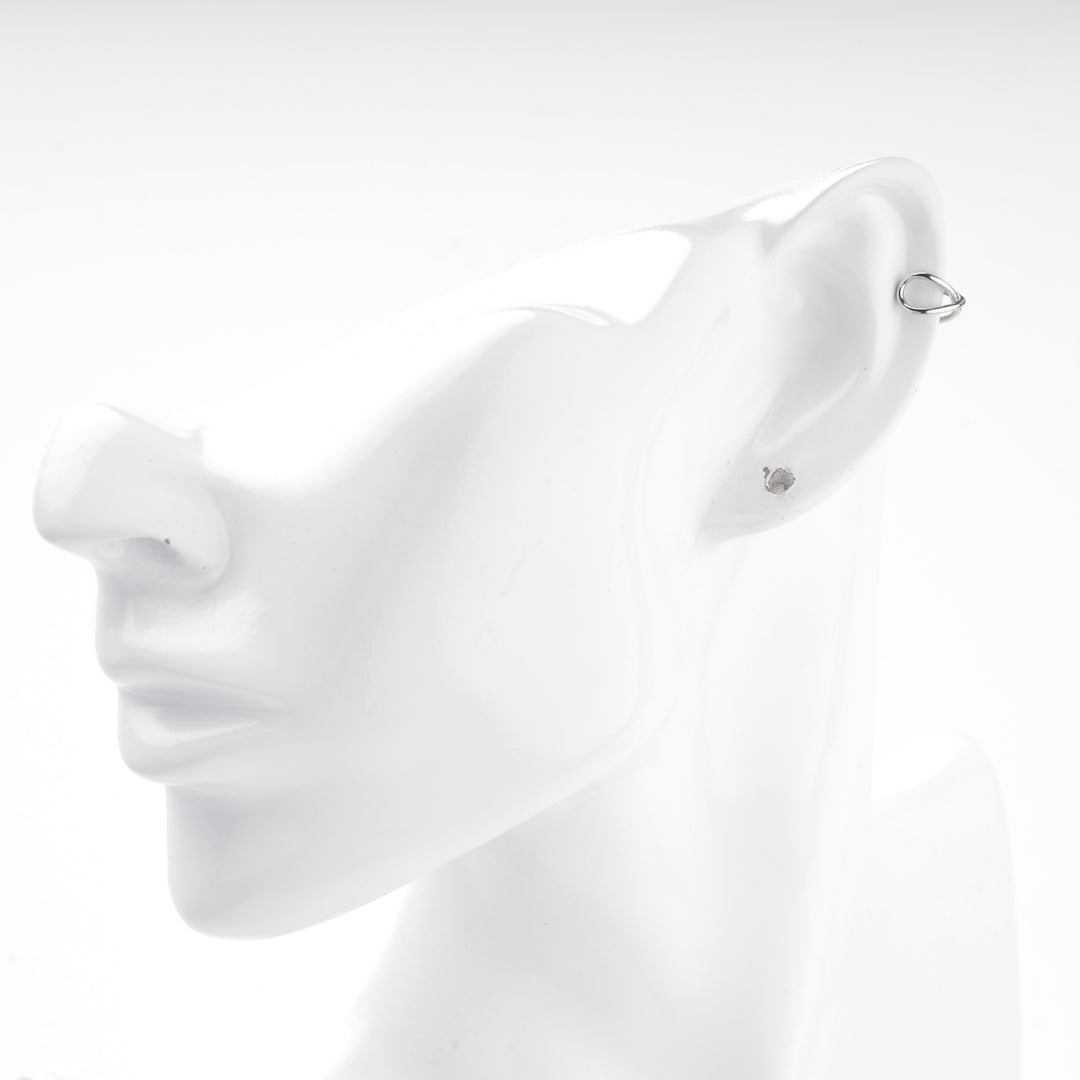 Close view of the silver 925 crossover ear cuff on a mannequin