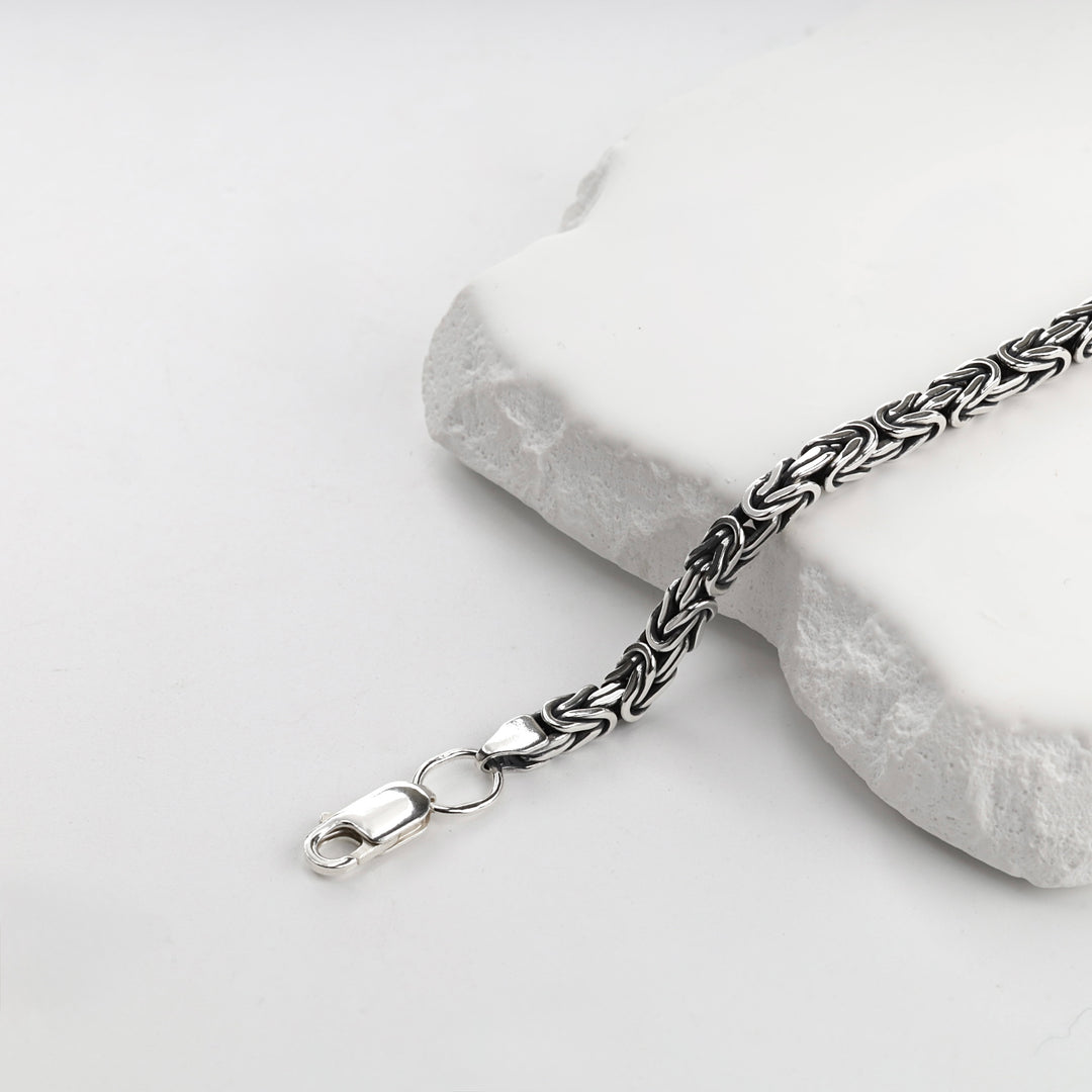 Silver 925 Byzantine bracelet with oxidized detailing, studio view