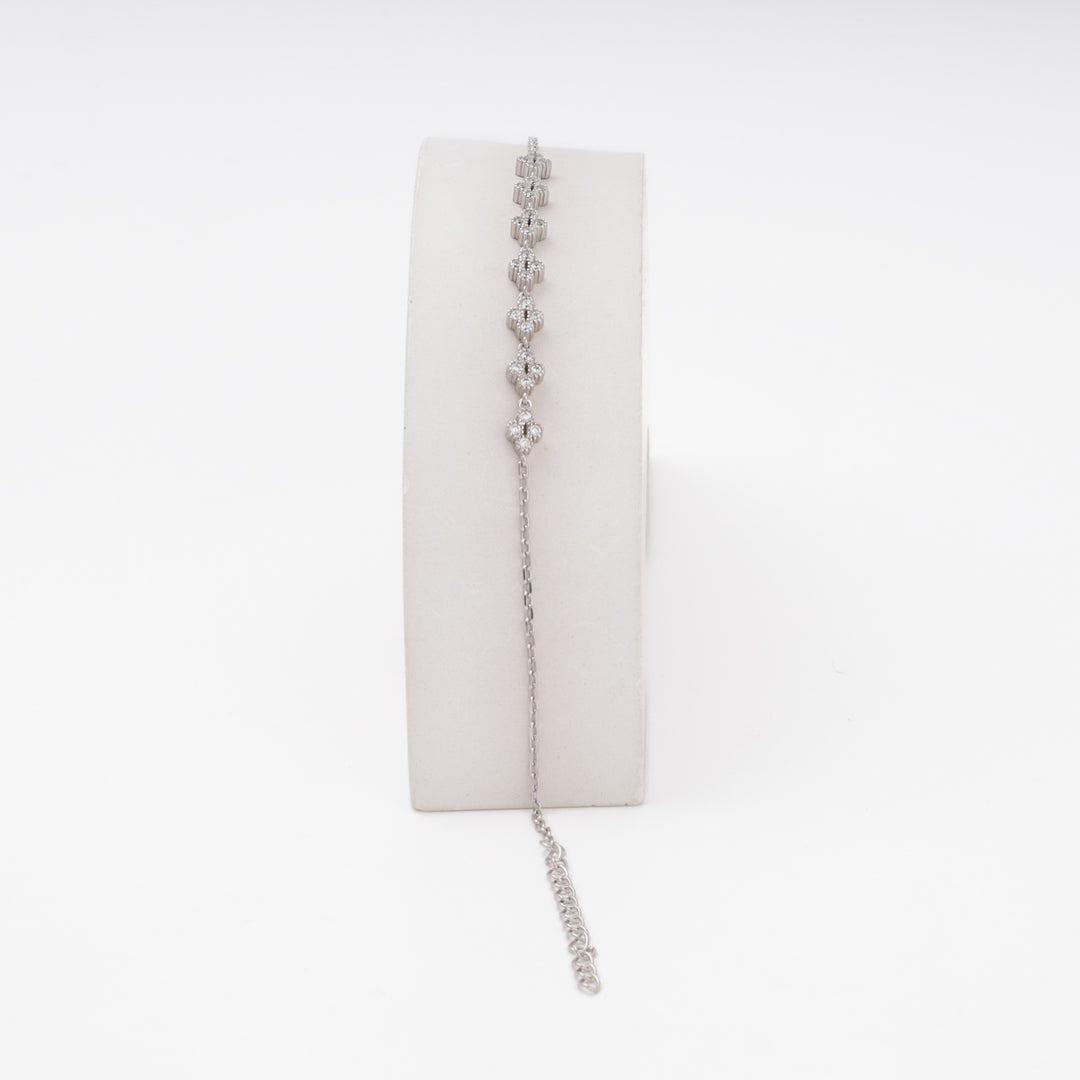 Silver flower charm bracelet on stand, delicate CZ blooms — Ukrainian Jewelry