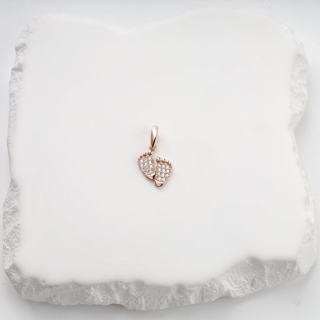 Rose gold baby feet pendant with pavé cubic zirconia soles, front view