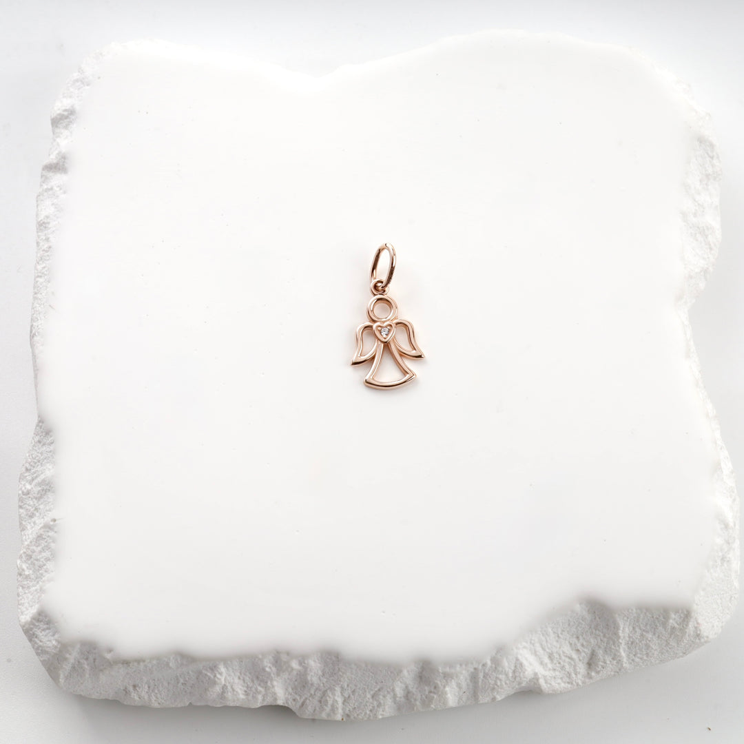 14K rose gold angel pendant with a heart accent, close view