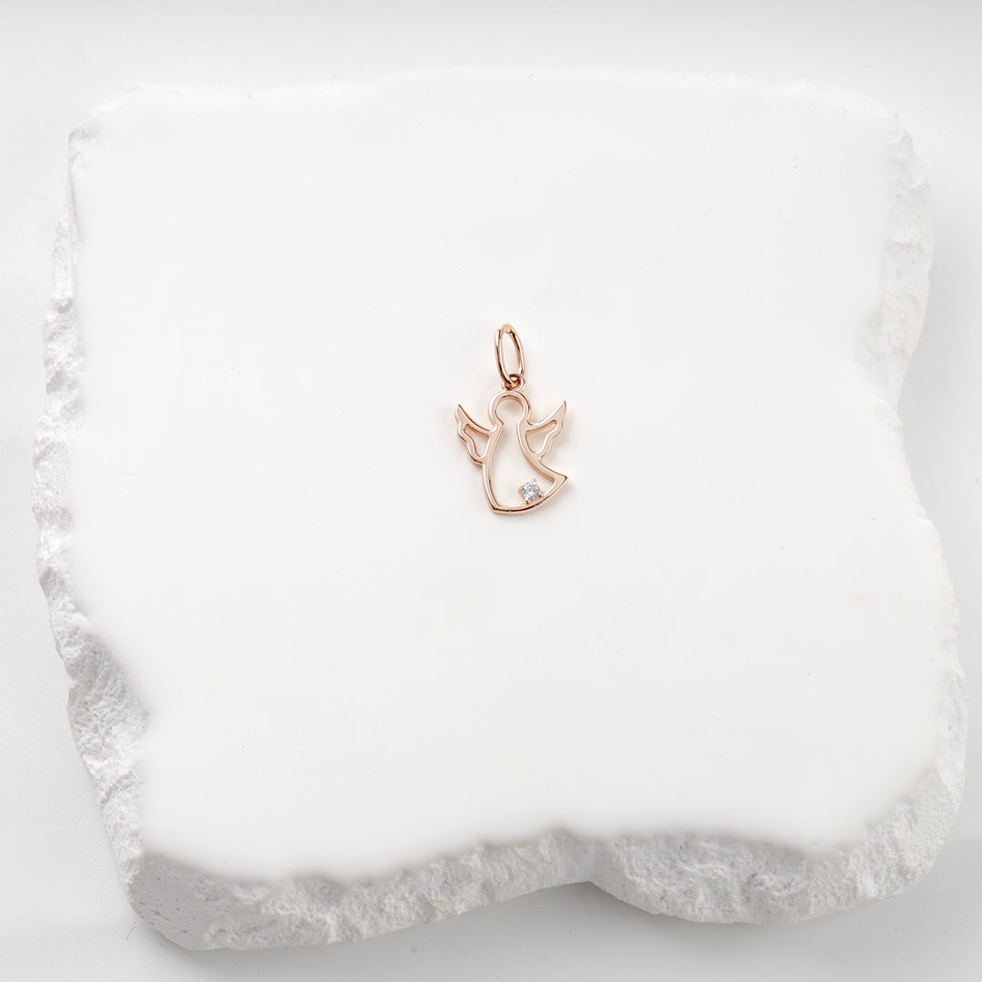 14K rose gold openwork angel pendant with a cubic zirconia, close view