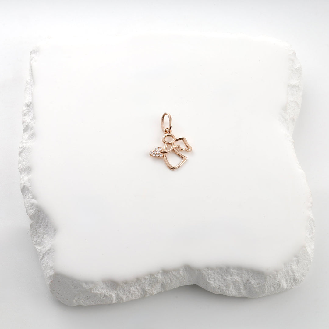 14K rose gold profile angel pendant with a cubic zirconia heart, close view
