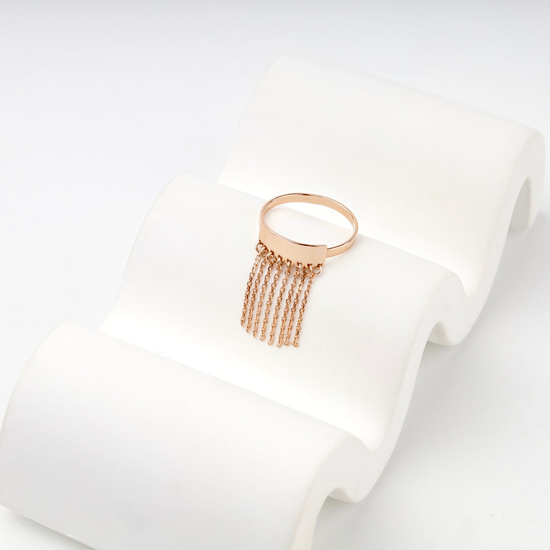 Rose gold chain tassel ring detail