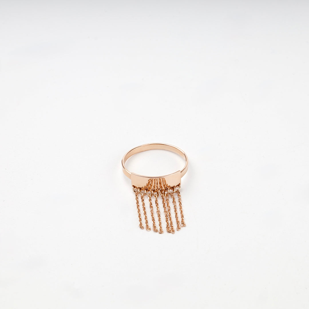 Rose gold fringe ring chain tassels close-up