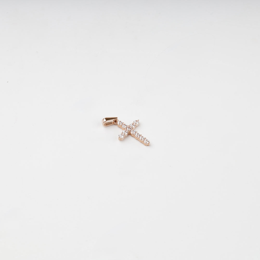 Rose gold cubic zirconia cross pendant, overhead view