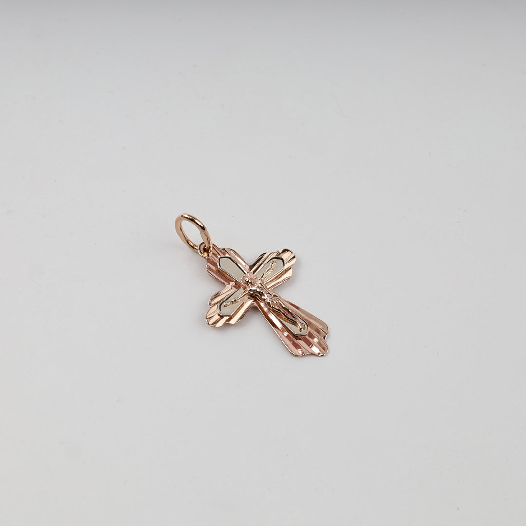 Rose gold crucifix pendant, detail of the figure of Christ