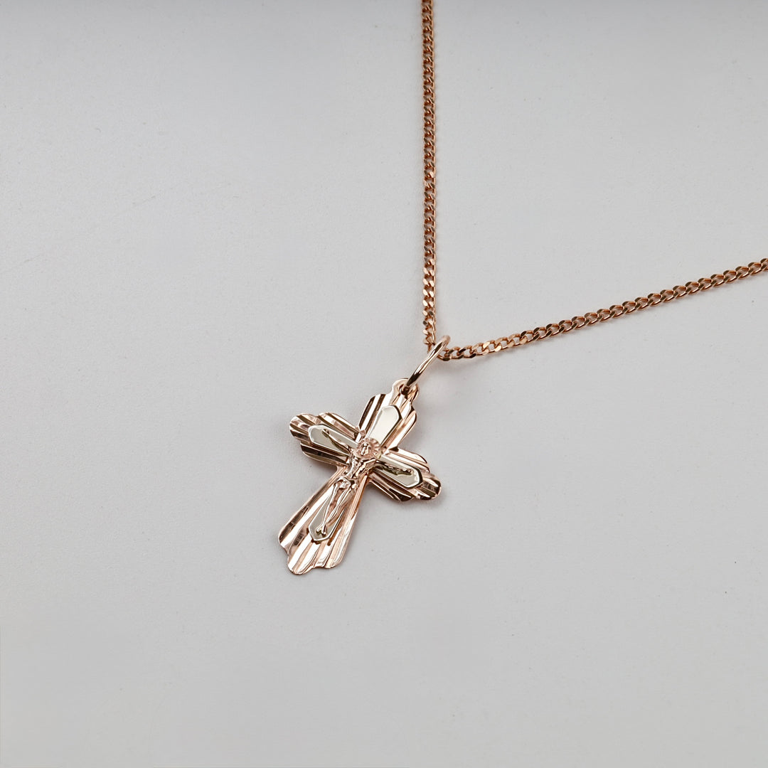 Orthodox cross pendant in rose gold, angled studio view