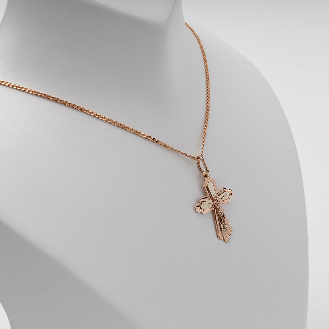 Rose gold cross pendant, side profile
