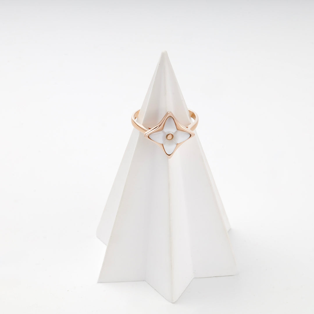 Rose gold star ring with mother of pearl angled view