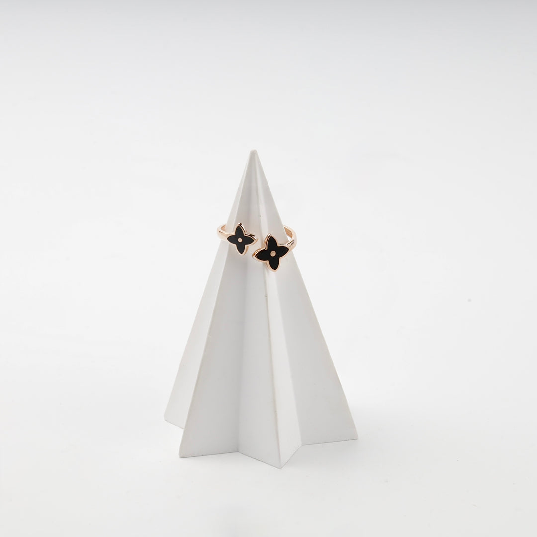 Rose gold ring with black enamel flower detail