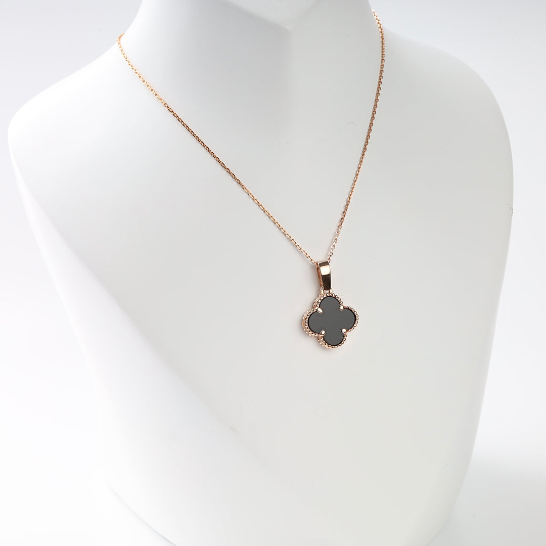 Clover Black Onyx Pendant in 14K Rose Gold — flat lay on white background
