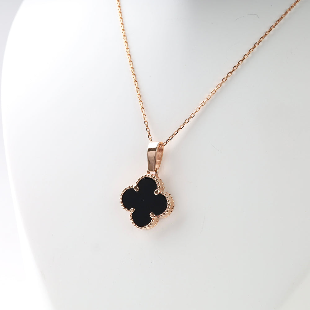 Clover Black Onyx Pendant in 14K Rose Gold — close-up of milgrain bezel and onyx
