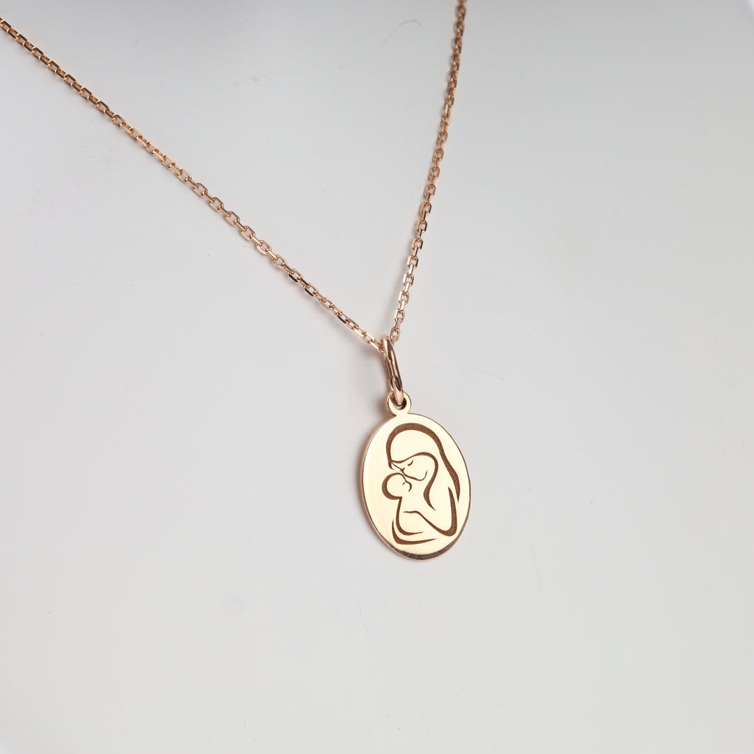 Mother and Child Pendant in 14K Rose Gold — styled on cable chain