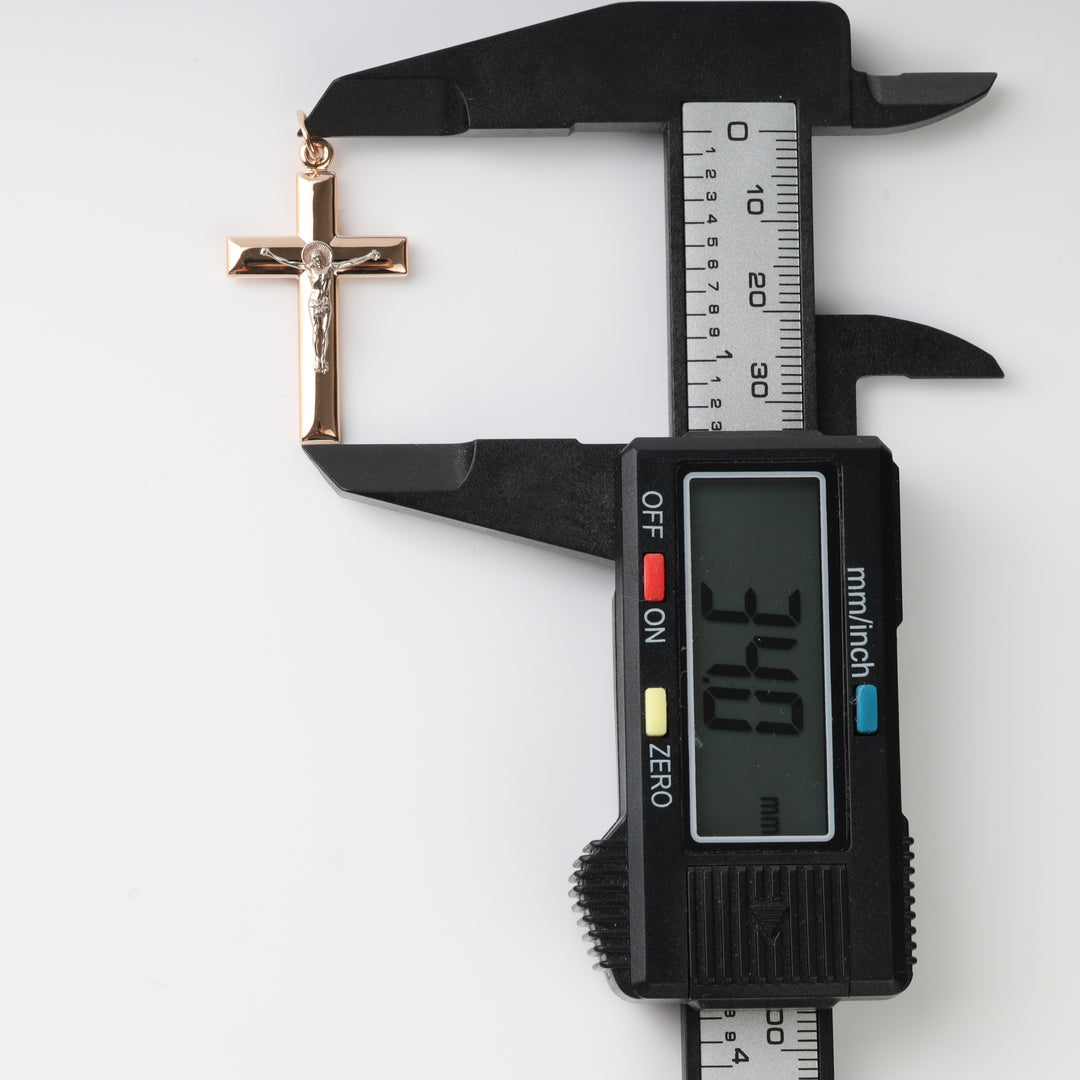 Crucifix Cross Pendant in 14K Rose Gold — front view showing beveled edges