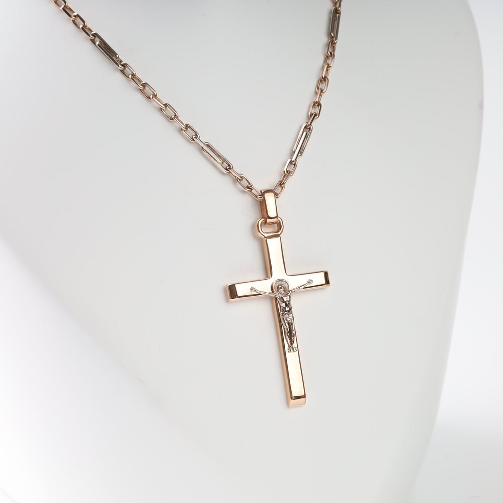 Crucifix Cross Pendant in 14K Rose Gold — angled view showing relief