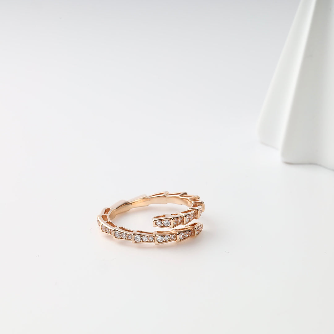 Serpenti Wrap Ring with Cubic Zirconia in 14K Rose Gold — styled side view on white
