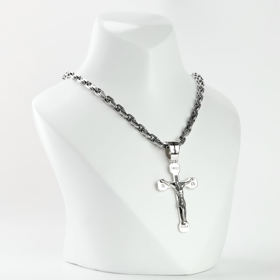 Orthodox crucifix pendant with figure of Christ and black enamel lettering