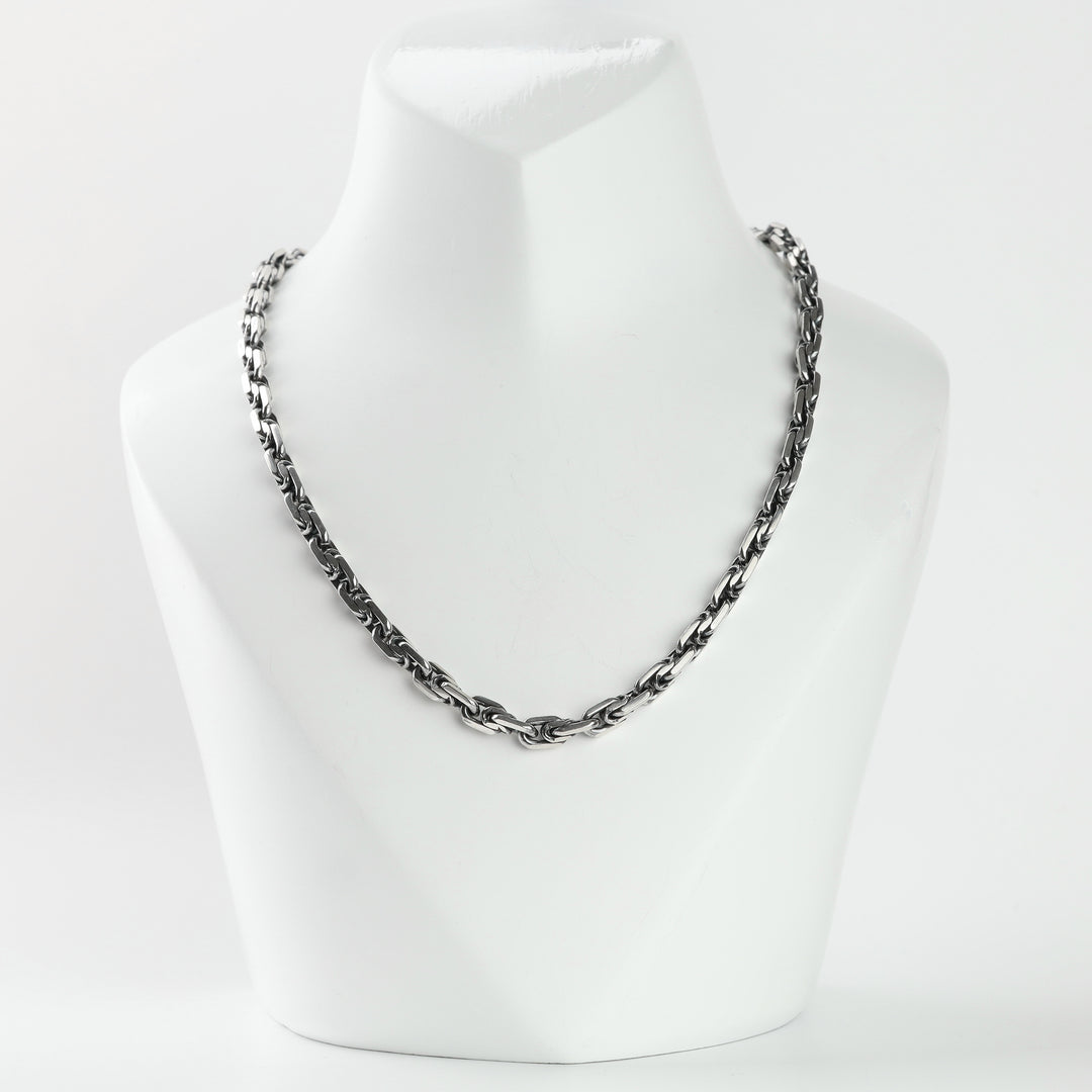 Silver 925 anchor link chain necklace for men on a display bust