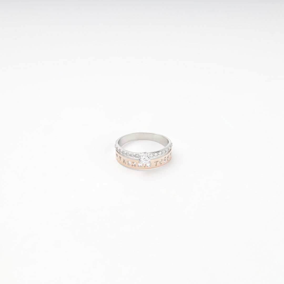 Silver 925 pierced heart ring standing on a plain white surface