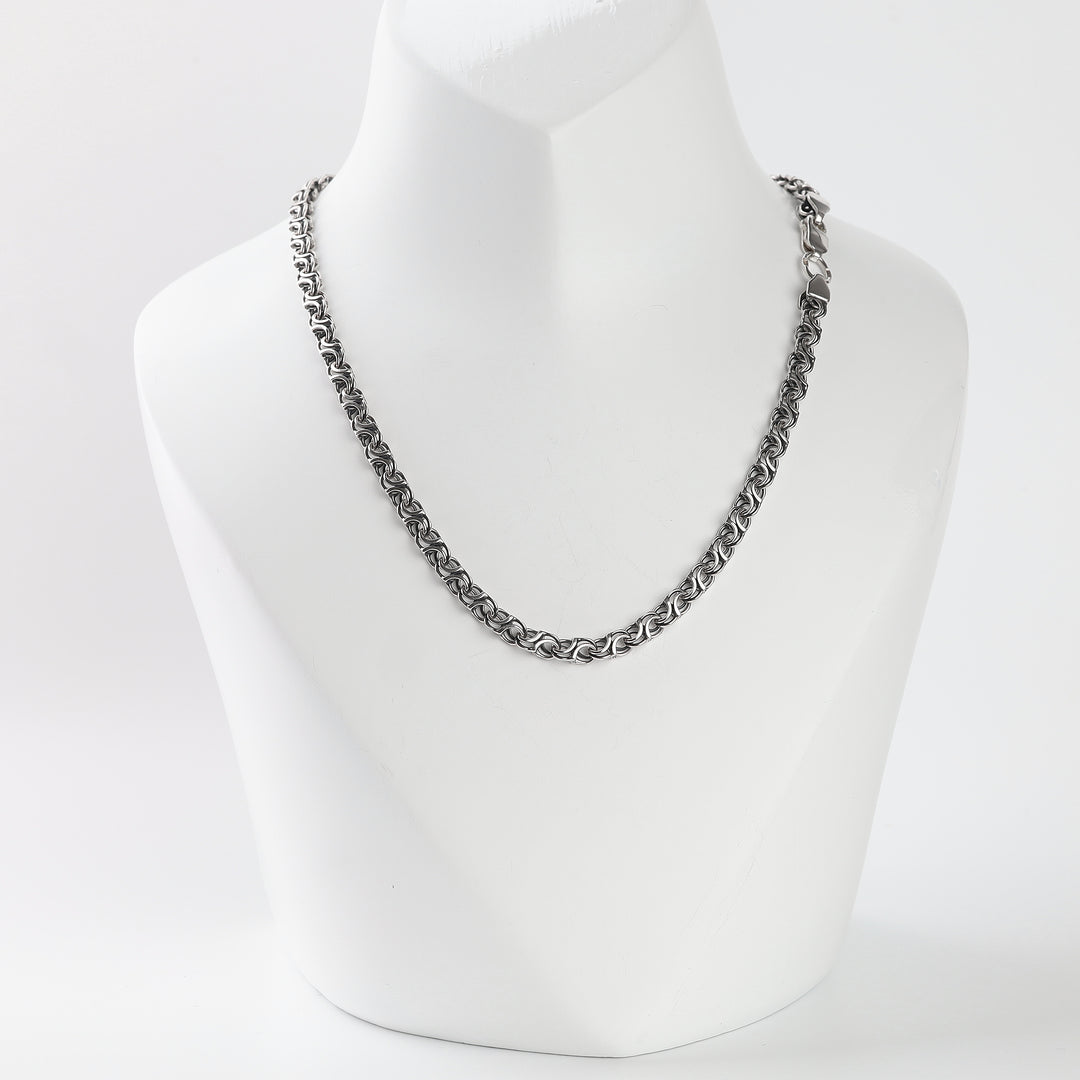 Silver 925 double-link chain necklace for men on a display bust
