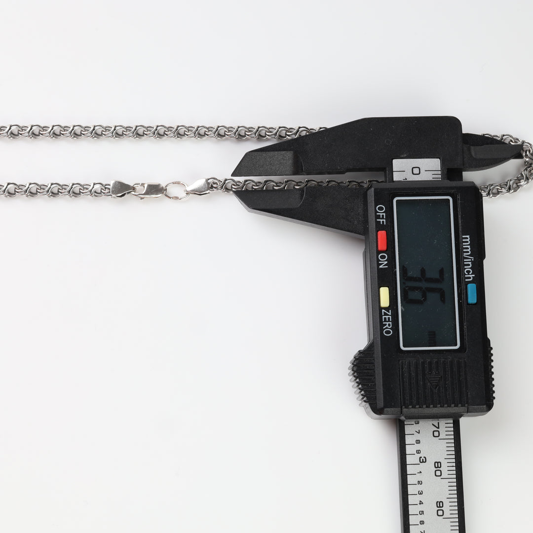 Silver chain width measured with a caliper at 3.6 mm