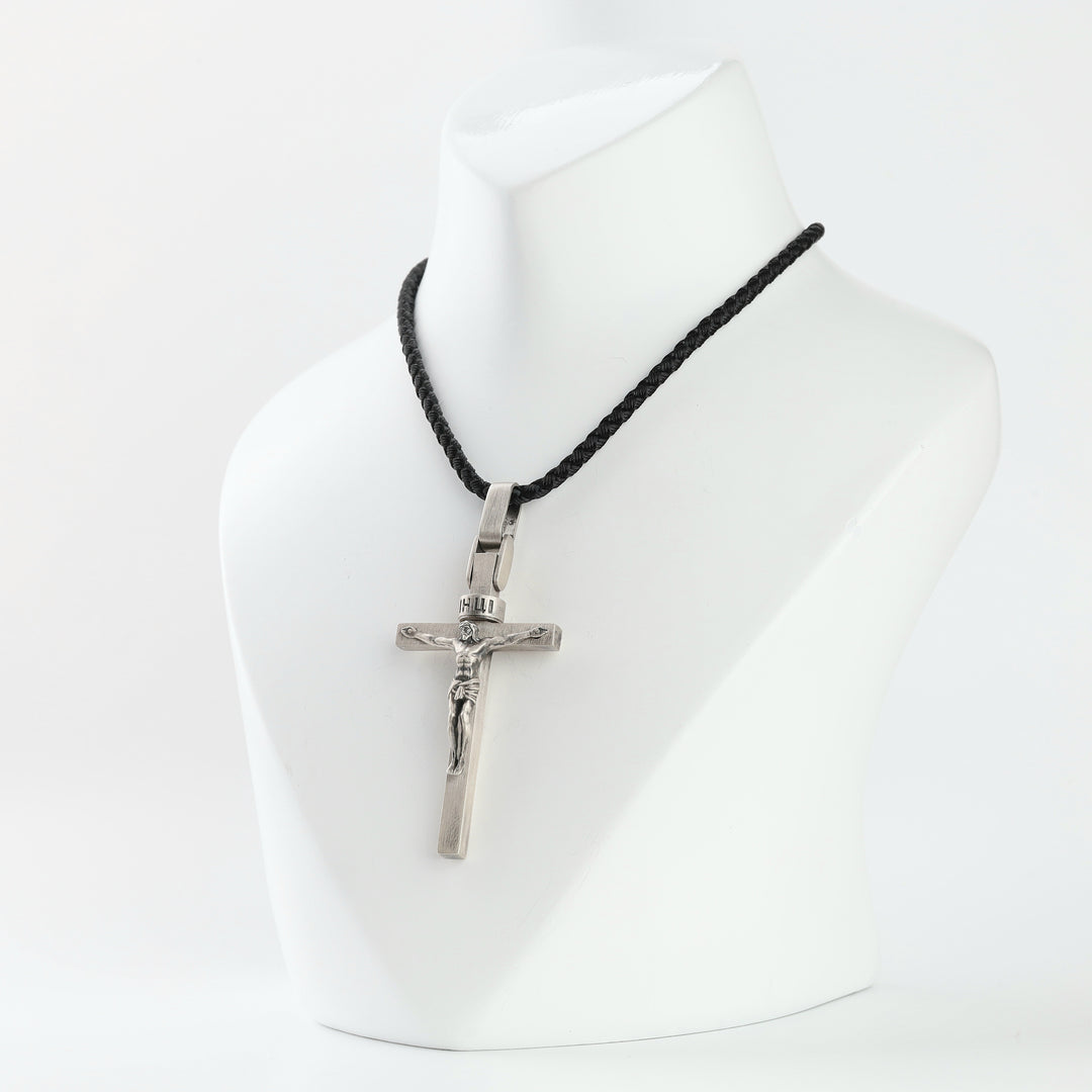 Silver crucifix pendant with oxidized Christ corpus and INRI title