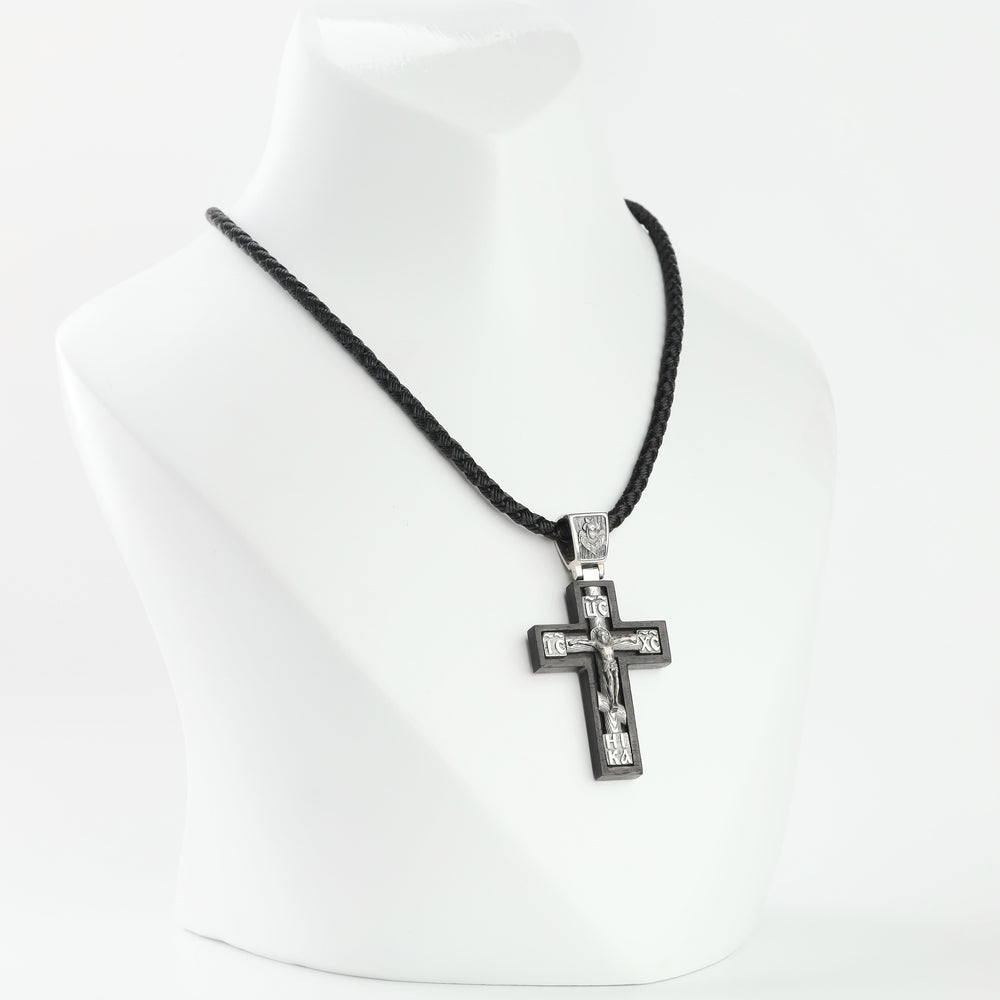 Ebony cross pendant with sterling silver crucifix overlay, front view